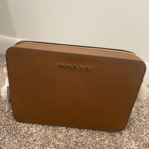 Brown Micheal Kors cross body bag. New with tags